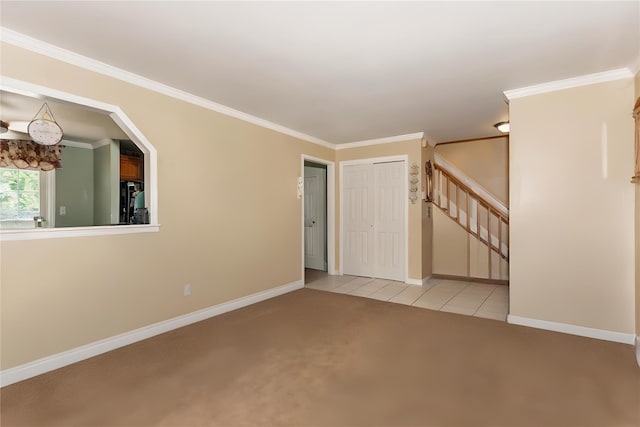 1191 E 3rd Ave, Bay Shore, NY 11706 - empty room featuring light carpet, stairs, crown molding, and light tile patterned flooring
