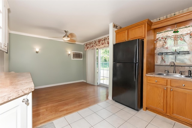 1191 E 3rd Ave, Bay Shore, NY 11706 - kitchen featuring freestanding refrigerator, a wall mounted air conditioner, ornamental molding, a ceiling fan, and light countertops
