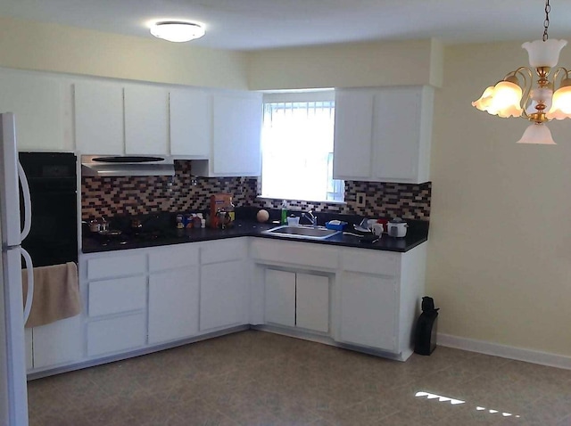 8502 57th Rd, Elmhurst, NY 11373 - kitchen with dark countertops, a chandelier, decorative backsplash, and white cabinets