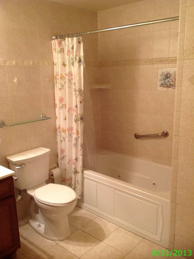 8502 57th Rd, Elmhurst, NY 11373 - full bathroom with tile patterned floors, vanity, and a combined bath / shower with jetted tub