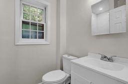 10 Valentine St, Glen Cove, NY 11542 - bathroom with vanity and toilet