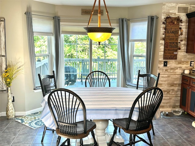 1002 Forest Gln, New Windsor, NY 12553 - dining area with healthy amount of natural light and dark tile patterned flooring