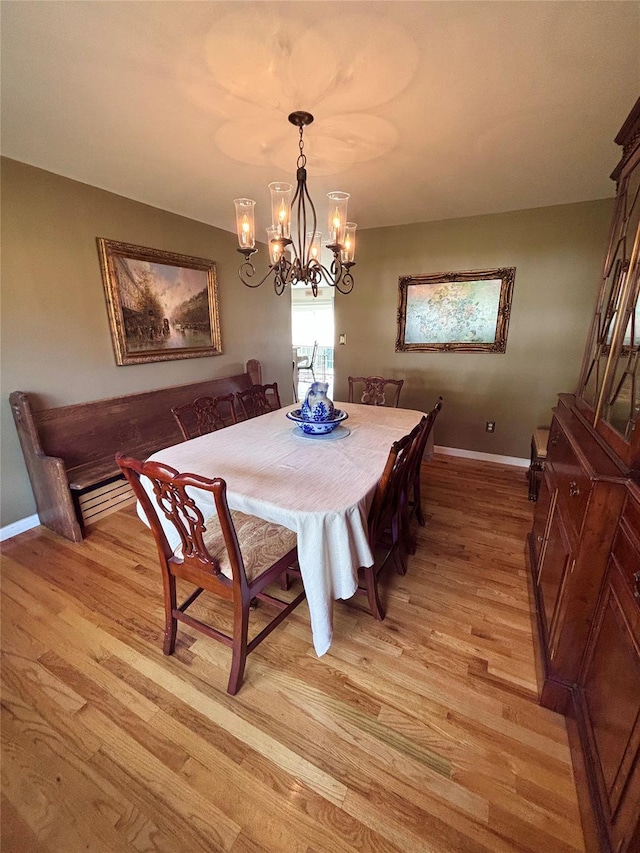 1002 Forest Gln, New Windsor, NY 12553 - dining space with light wood-style flooring and a chandelier