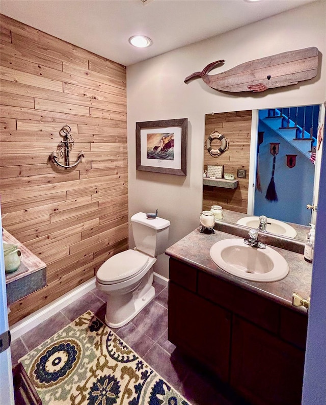 1002 Forest Gln, New Windsor, NY 12553 - half bath with vanity, tile patterned floors, and wooden walls