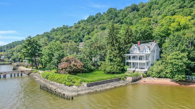 165 River Rd, Nyack, NY 10960 - aerial view of property and surrounding area featuring a nearby body of water and a heavily wooded area