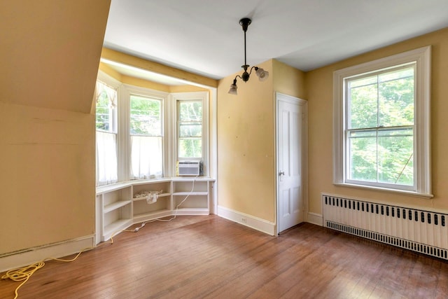 165 River Rd, Nyack, NY 10960 - unfurnished dining area with radiator heating unit and hardwood / wood-style flooring