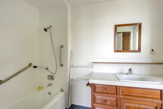 165 River Rd, Nyack, NY 10960 - bathroom featuring vanity,  shower combination, and tile walls