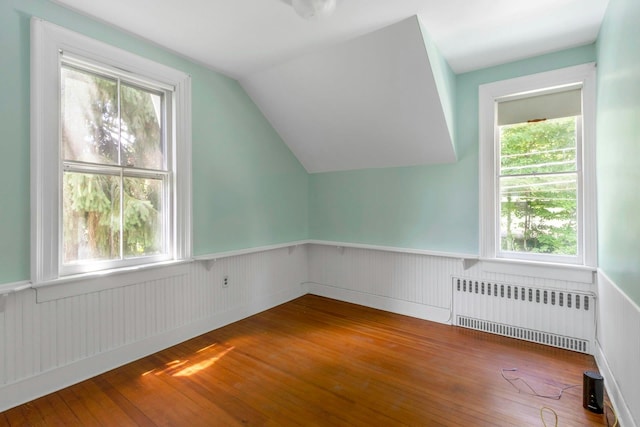165 River Rd, Nyack, NY 10960 - additional living space with radiator heating unit, wainscoting, wood-type flooring, and lofted ceiling