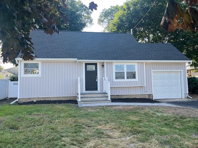 123 Buffalo Ave, Lindenhurst, NY 11757 - view of front of property featuring a garage, entry steps, driveway, and a shingled roof
