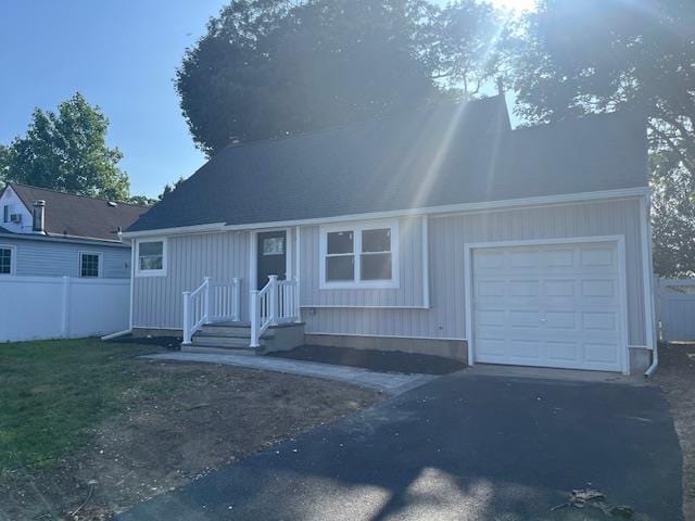 123 Buffalo Ave, Lindenhurst, NY 11757 - view of front of house with asphalt driveway and an attached garage