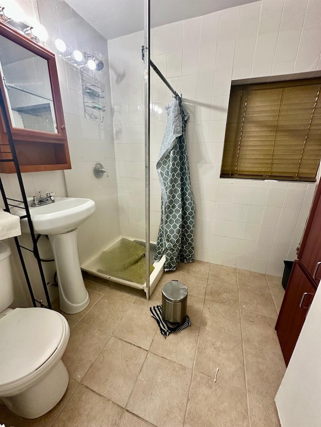 153-15 79th Ave, Flushing, NY 11367 - bathroom featuring tile walls, a stall shower, and tile patterned floors
