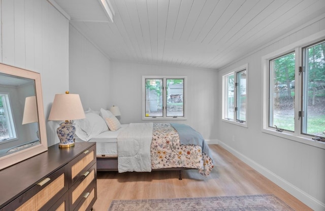 164 Maple Rd, Wading River, NY 11792 - bedroom featuring light wood-style floors, lofted ceiling, wooden ceiling, and crown molding