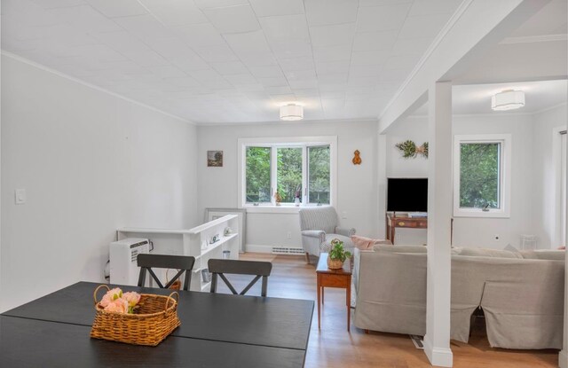 164 Maple Rd, Wading River, NY 11792 - dining room featuring crown molding and wood finished floors