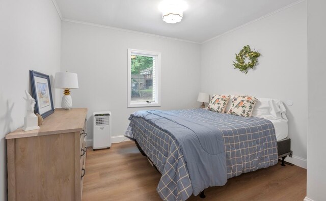 164 Maple Rd, Wading River, NY 11792 - bedroom with wood finished floors and crown molding