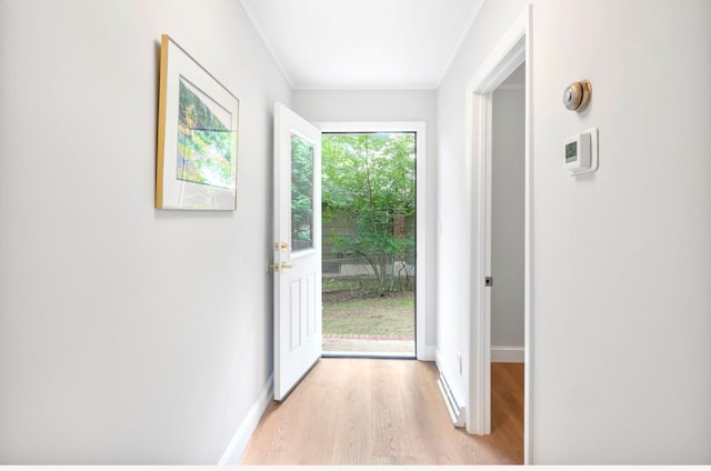 164 Maple Rd, Wading River, NY 11792 - doorway featuring light wood-style flooring and ornamental molding