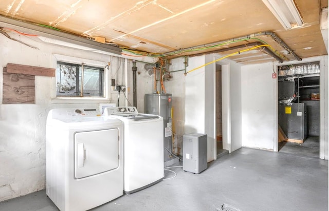 164 Maple Rd, Wading River, NY 11792 - below grade area featuring washer and dryer and electric water heater