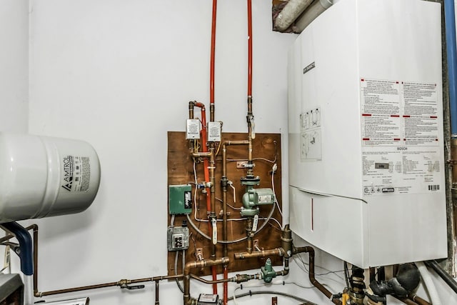 10 Garfield Pl, Massapequa, NY 11758 - utility room with water heater