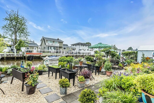 10 Garfield Pl, Massapequa, NY 11758 - view of patio featuring a residential view and a water view