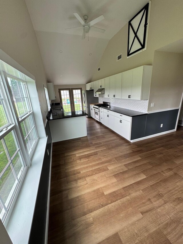 2117 Rte 82, Lagrangeville, NY 12540 - unfurnished living room featuring high vaulted ceiling, french doors, wood finished floors, and a ceiling fan