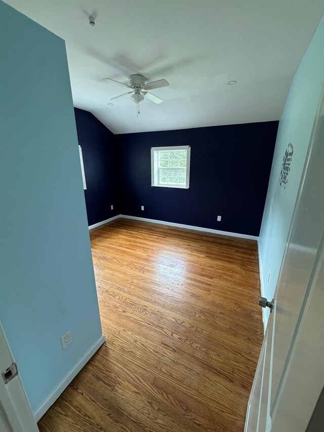 2117 Rte 82, Lagrangeville, NY 12540 - empty room with ceiling fan, wood finished floors, lofted ceiling, and a smoke detector
