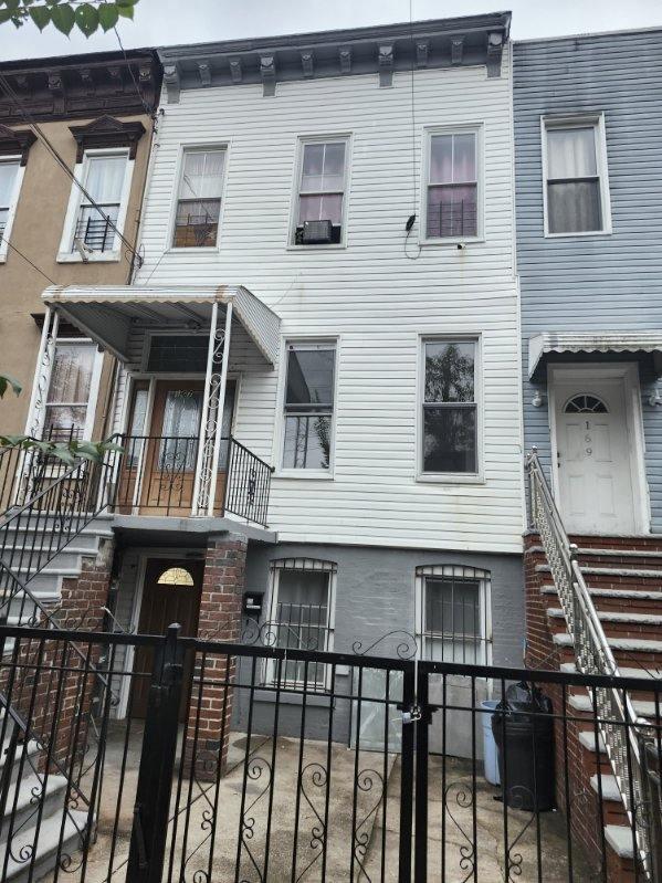 167 Euclid Ave, Brooklyn, NY 11208 - view of front of house featuring a fenced front yard and cooling unit