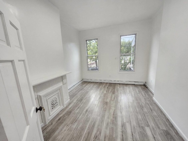 167 Euclid Ave, Brooklyn, NY 11208 - unfurnished living room featuring wood finished floors and baseboards