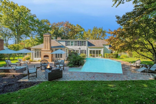 7 Westview Ln, Scarsdale, NY 10583 - rear view of property with a patio, a fire pit, and a lawn