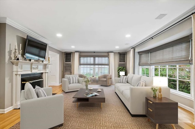 7 Westview Ln, Scarsdale, NY 10583 - living area featuring crown molding, recessed lighting, a fireplace, and wood finished floors