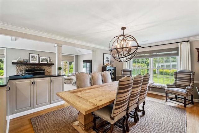 7 Westview Ln, Scarsdale, NY 10583 - dining room with light wood finished floors, a chandelier, and ornamental molding