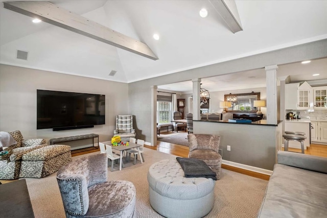 7 Westview Ln, Scarsdale, NY 10583 - living room featuring ornate columns, light wood-type flooring, beam ceiling, recessed lighting, and high vaulted ceiling