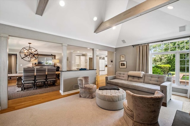 7 Westview Ln, Scarsdale, NY 10583 - living room with wood finished floors, ornate columns, beam ceiling, a chandelier, and recessed lighting