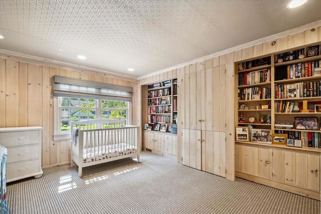 7 Westview Ln, Scarsdale, NY 10583 - carpeted bedroom featuring wooden walls, ornamental molding, and recessed lighting