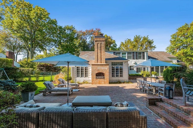 7 Westview Ln, Scarsdale, NY 10583 - view of patio / terrace with an outdoor living space with a fireplace