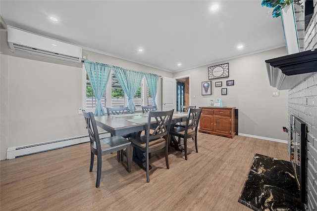 24 Border Ln, Levittown, NY 11756 - dining room featuring a wall mounted air conditioner, a baseboard radiator, light wood-style floors, a fireplace, and recessed lighting