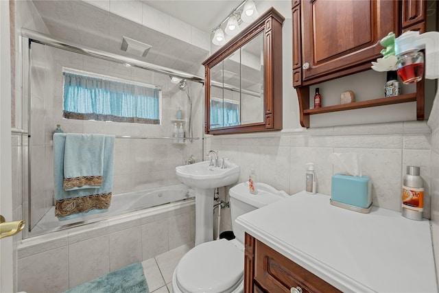 24 Border Ln, Levittown, NY 11756 - bathroom featuring tiled shower / bath and toilet