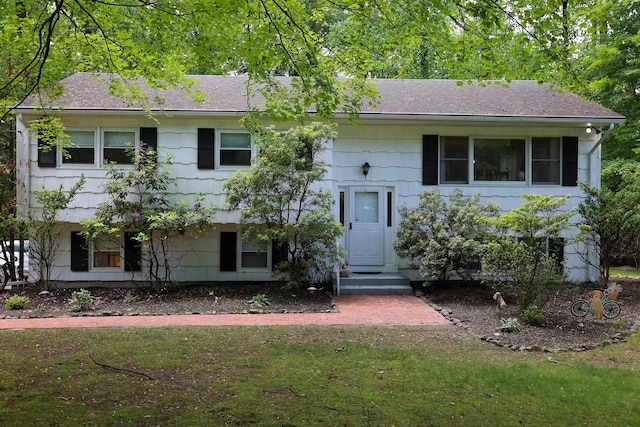 21 Edgebrook Ln, Airmont, NY 10952 - raised ranch featuring a front lawn and a shingled roof