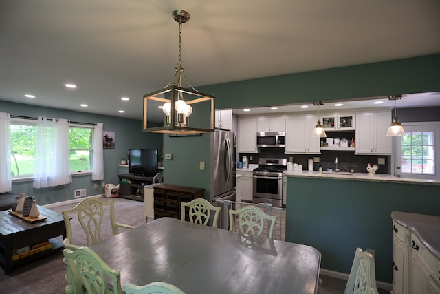 21 Edgebrook Ln, Airmont, NY 10952 - dining room featuring plenty of natural light, a chandelier, recessed lighting, and carpet flooring