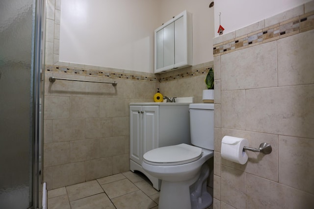 21 Edgebrook Ln, Airmont, NY 10952 - bathroom featuring tile walls, tile patterned flooring, vanity, a stall shower, and wainscoting