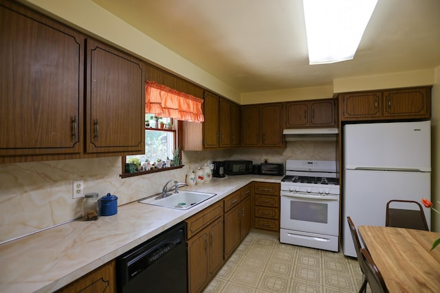 21 Edgebrook Ln, Airmont, NY 10952 - kitchen featuring black appliances, under cabinet range hood, decorative backsplash, wood counters, and light floors