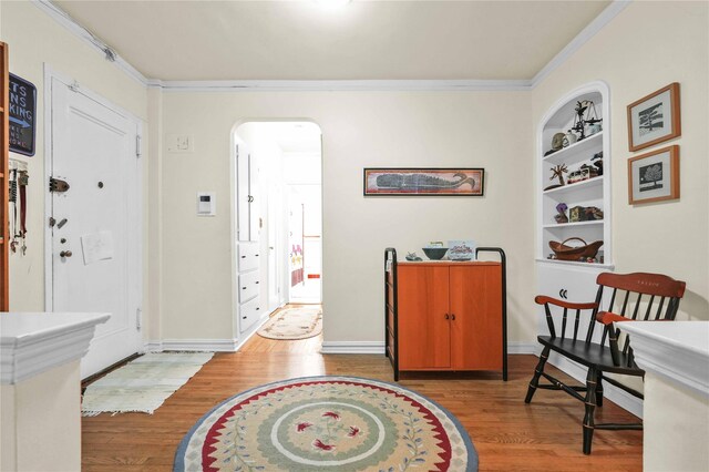 84-51 Beverly Rd Unit 5P, Kew Gardens, NY 11415 - entrance foyer with wood finished floors, crown molding, and arched walkways