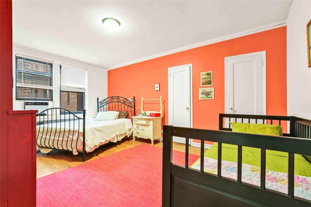 84-51 Beverly Rd Unit 5P, Kew Gardens, NY 11415 - bedroom with wood finished floors and crown molding