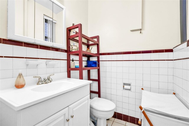 84-51 Beverly Rd Unit 5P, Kew Gardens, NY 11415 - bathroom featuring tile walls, vanity, and tile patterned flooring