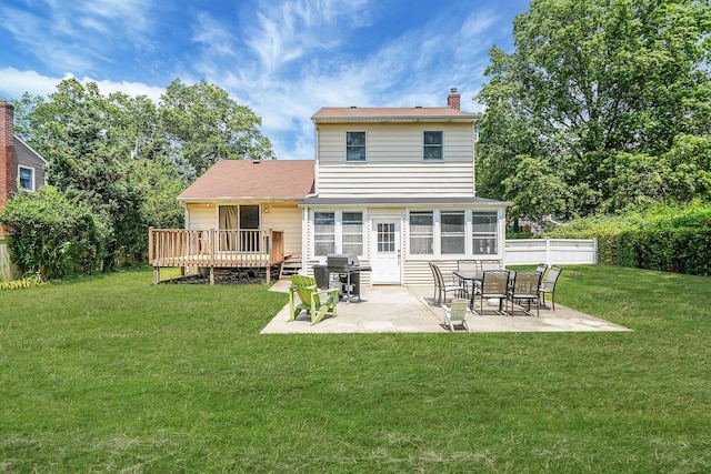 2772 Cypress Ave, East Meadow, NY 11554 - back of property featuring a chimney, a deck, and a patio area