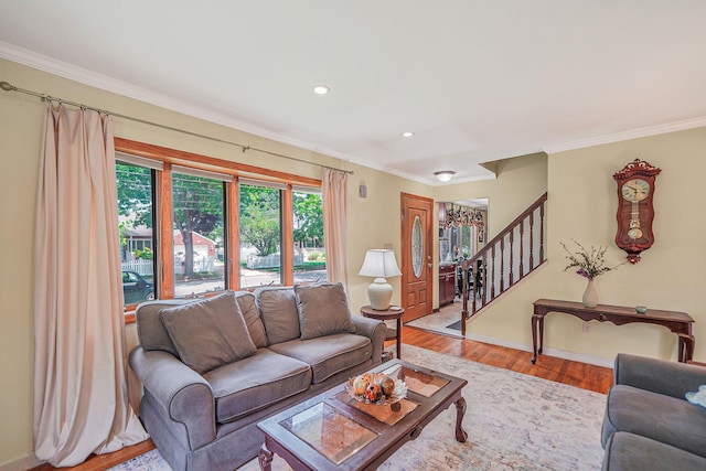 2772 Cypress Ave, East Meadow, NY 11554 - living area with crown molding, wood finished floors, stairs, and recessed lighting