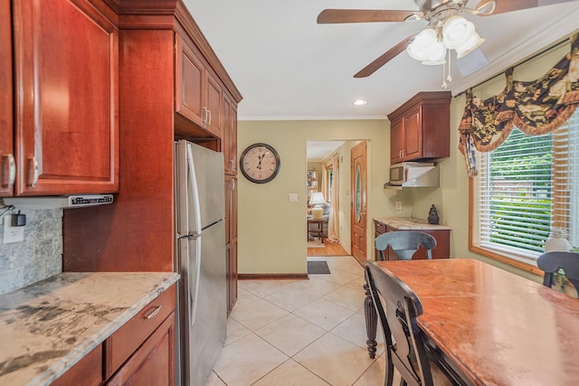 2772 Cypress Ave, East Meadow, NY 11554 - kitchen featuring freestanding refrigerator, light tile patterned flooring, crown molding, a ceiling fan, and tasteful backsplash