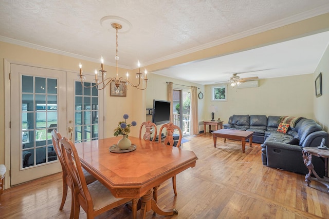 2772 Cypress Ave, East Meadow, NY 11554 - dining room featuring light wood-style floors, a chandelier, and crown molding