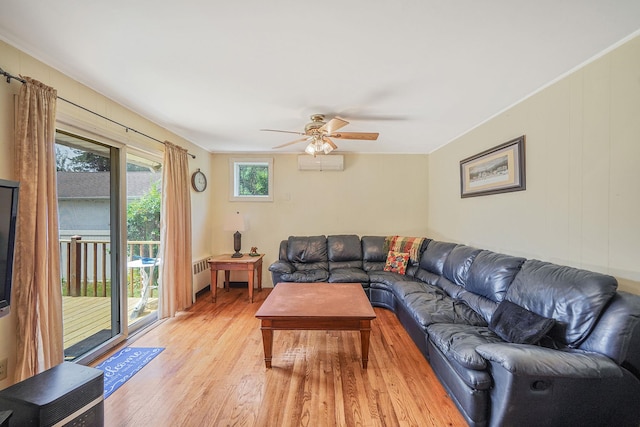 2772 Cypress Ave, East Meadow, NY 11554 - living area with light wood finished floors, ceiling fan, radiator, and a wall mounted AC