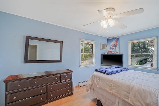 2772 Cypress Ave, East Meadow, NY 11554 - bedroom with light wood-style floors, a baseboard radiator, an AC wall unit, a ceiling fan, and ornamental molding