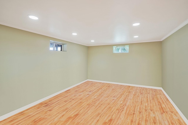 2772 Cypress Ave, East Meadow, NY 11554 - below grade area with ornamental molding, wood finished floors, recessed lighting, and healthy amount of natural light