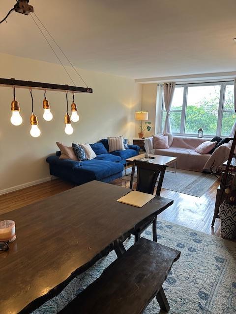 18-65 211th St Unit 5D, Bayside, NY 11360 - living area with wood finished floors and baseboards